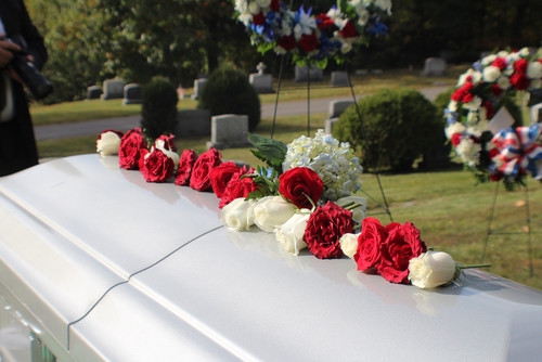 Flowers atop a casket.