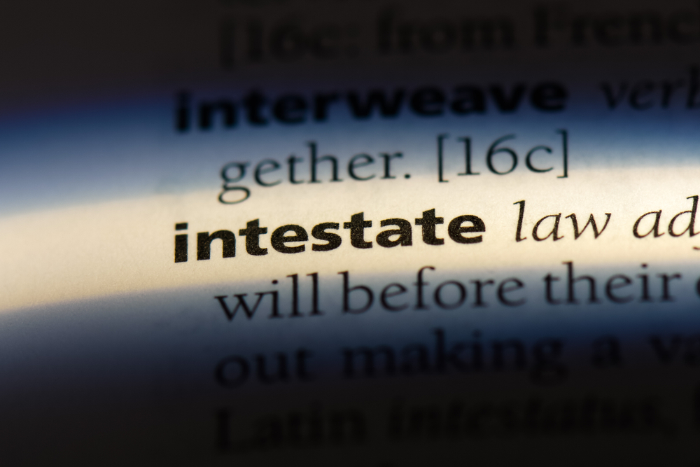 The word intestate is highlighted on a dictionary page.